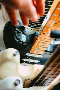 Close-up of man playing guitar