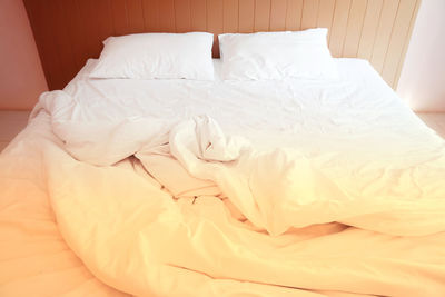 High angle view of messy bed