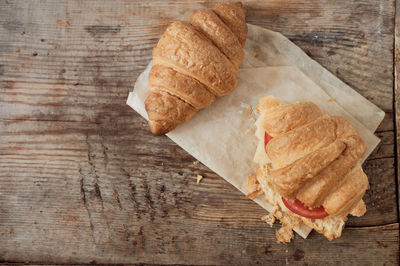 Morning breakfast of croissants. two croissants on a wooden background. hearty croissant 