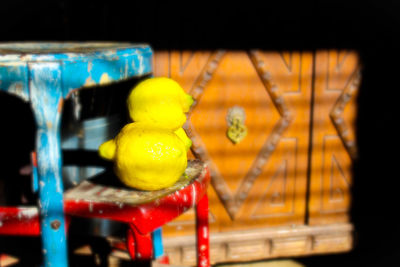 Close-up of yellow toys on wood