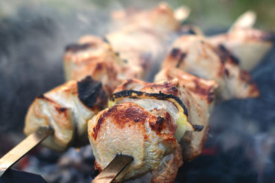 Close-up of meat on barbecue grill