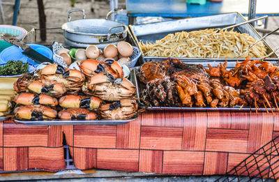 Street food stall selling crabs and grilled meats in koh kong, cambodia