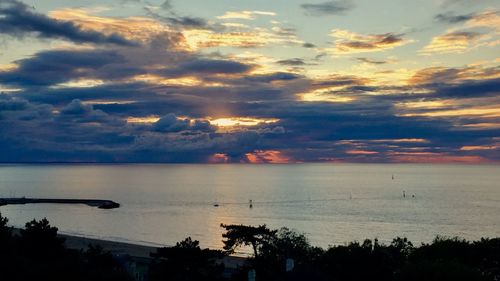 Scenic view of sea against cloudy sky