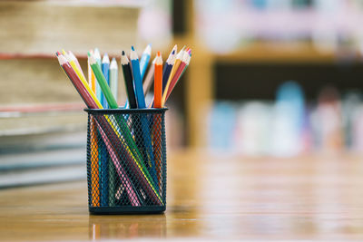 Close-up of multi colored pencils on table