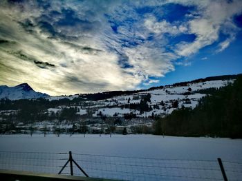 Scenic view of mountains against sky during winter