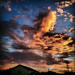 Scenic view of cloudy sky at sunset