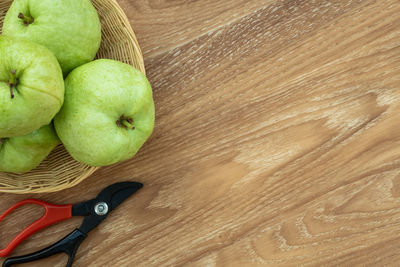 High angle view of apples in basket on table