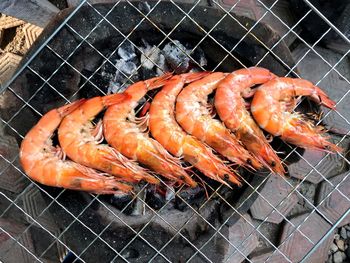 High angle view of meat on barbecue grill