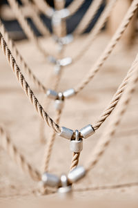 Close-up of chain tied on rope