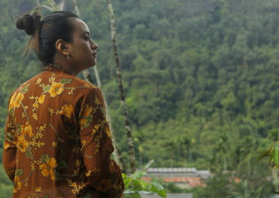 Rear view of woman looking at mountain