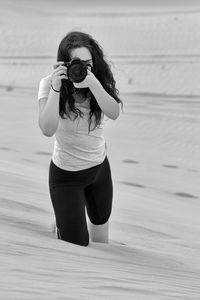 Young woman photographing