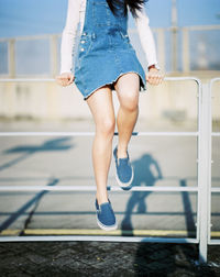 Low section of woman standing on ground