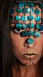 Close-up portrait of woman wearing headdress during halloween