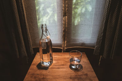 Close-up of wine glass on table at home