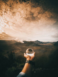 Man on mountain against sky