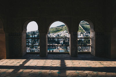 Buildings seen through arch window