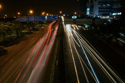 Illuminated city street at night