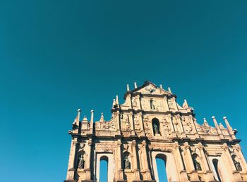 Low angle view of cathedral against clear blue sky