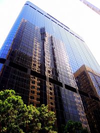 Low angle view of skyscrapers against clear sky