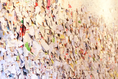 Close-up of papers on wall