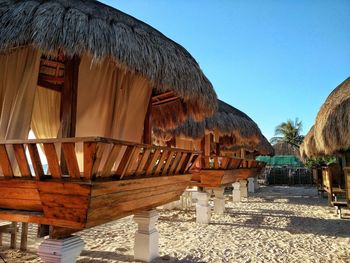 Built structure on beach against clear sky