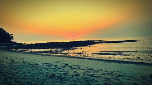 Scenic view of sea at sunset