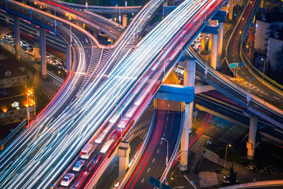 High angle view of light trails on city street at night