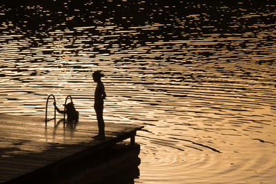 Bathing scene at the edge of lake barterand in the ain in the evening