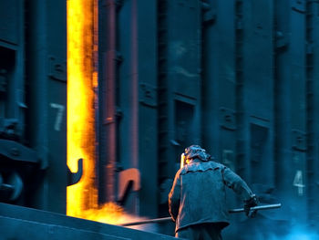 Worker working at coke oven in factory