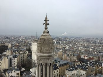 High angle view of city buildings against sky