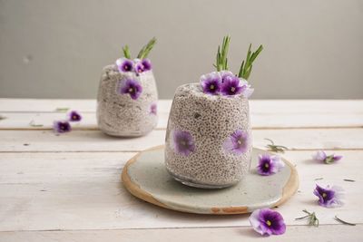 Close-up of purple flowers on table