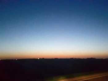 Scenic view of silhouette landscape against clear sky at night