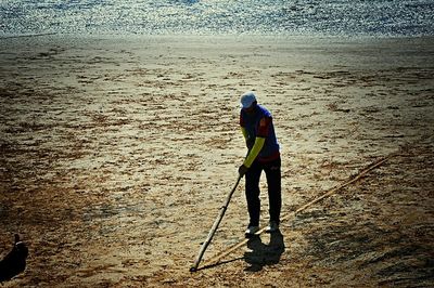 Full length of woman standing on beach