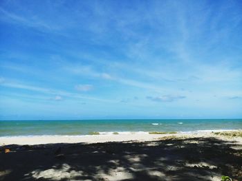 View of beach against blue sky