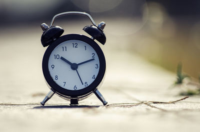 Close-up of alarm clock on table