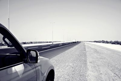 Car on road against clear sky