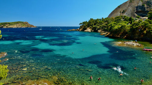 Scenic view of sea against clear blue sky