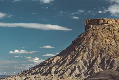 Medium shot of rock formation eroded by water near green river utah