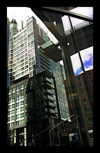 Low angle view of modern building against sky