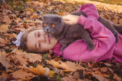 Cat sitting on girl