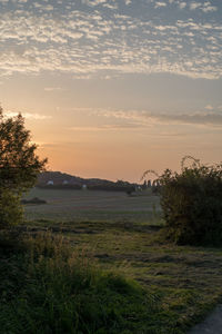 Scenic view of landscape against sky during sunset