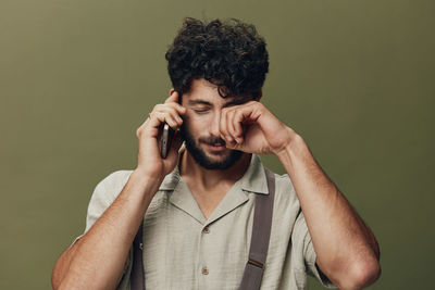 Young man talking on phone