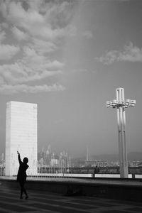 Silhouette of woman against sky