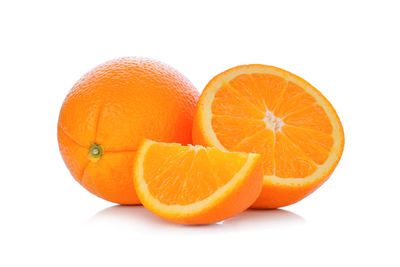 Close-up of oranges against white background