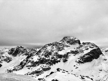 Scenic view of snow covered mountain against sky