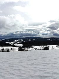 Scenic view of frozen lake against sky