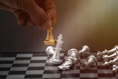 Low angle view of chess pieces on floor