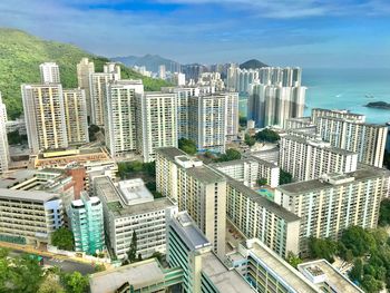 High angle view of buildings in city against sky