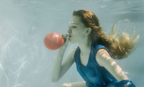 Close-up of young woman in water