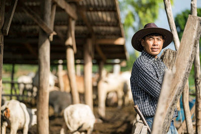 Portrait of senior man standing in farm